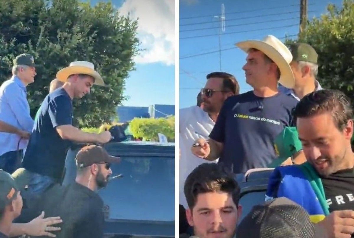 Em cima de caminhonete, Flávio Bolsonaro é "tietado" e distribui autógrafos em Sinop